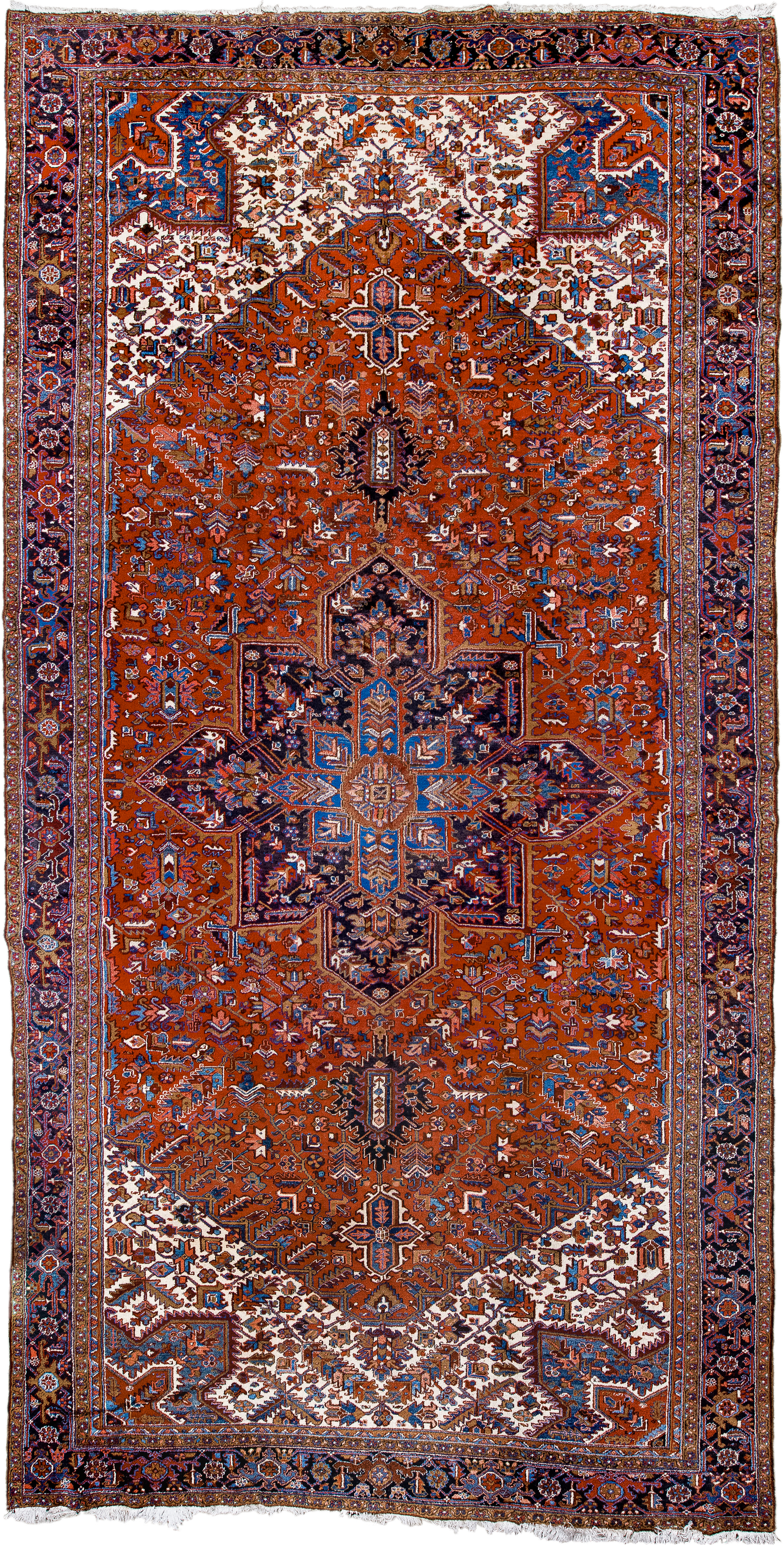 11' x 21' one-of-a-kind handmade antique Heriz oversize rug. Color palette: rust, ivory, navy, cobalt, terra cotta, charcoal