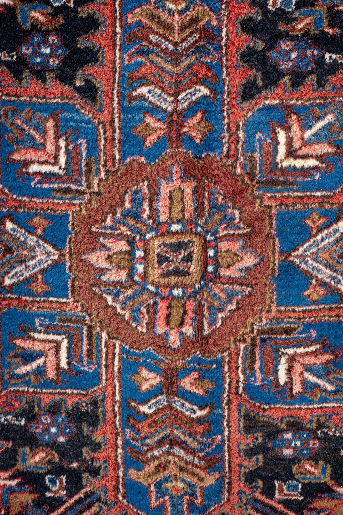 11' x 21' one-of-a-kind handmade antique Heriz oversize rug. Color palette: rust, ivory, navy, cobalt, terra cotta, charcoal
