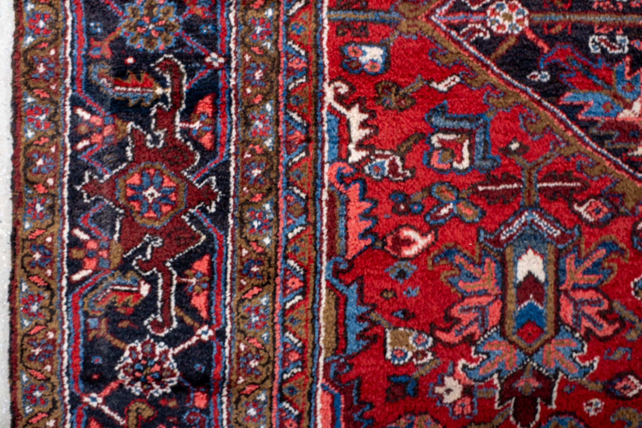 11' x 21' one-of-a-kind handmade antique Heriz oversize rug. Color palette: rust, ivory, navy, cobalt, terra cotta, charcoal