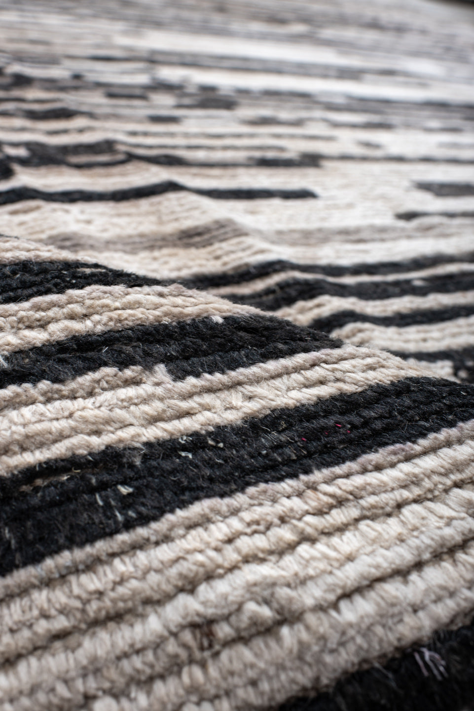10' x 13' one-of-a-kind handmade vintage Tulu large size rug. Color palette: ivory, charcoal, gray, black, taupe, beige