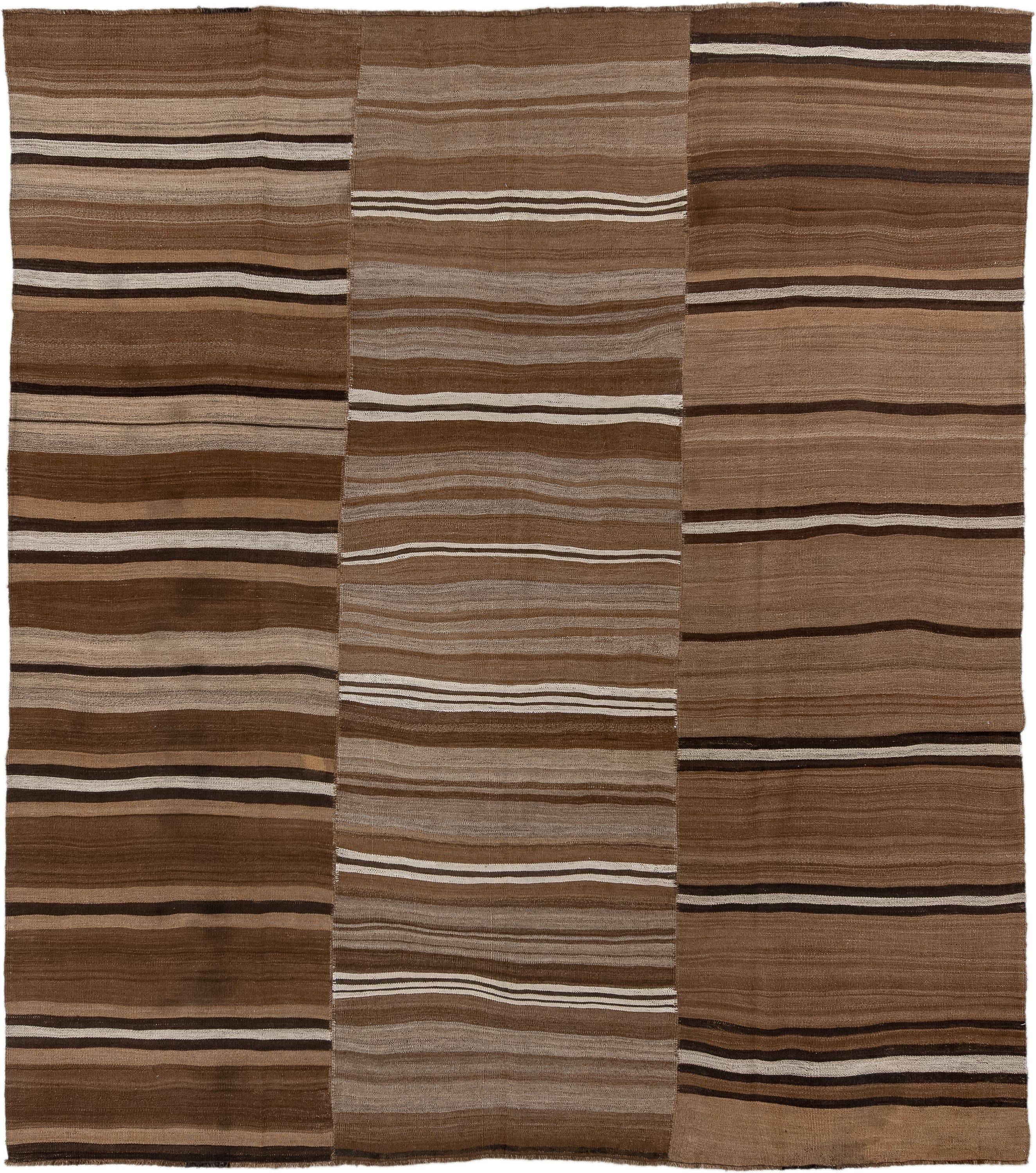 8' x 9' one-of-a-kind handmade vintage Kilim rug. Color palette: brown, taupe, camel, ivory, espresso, beige, gray, black