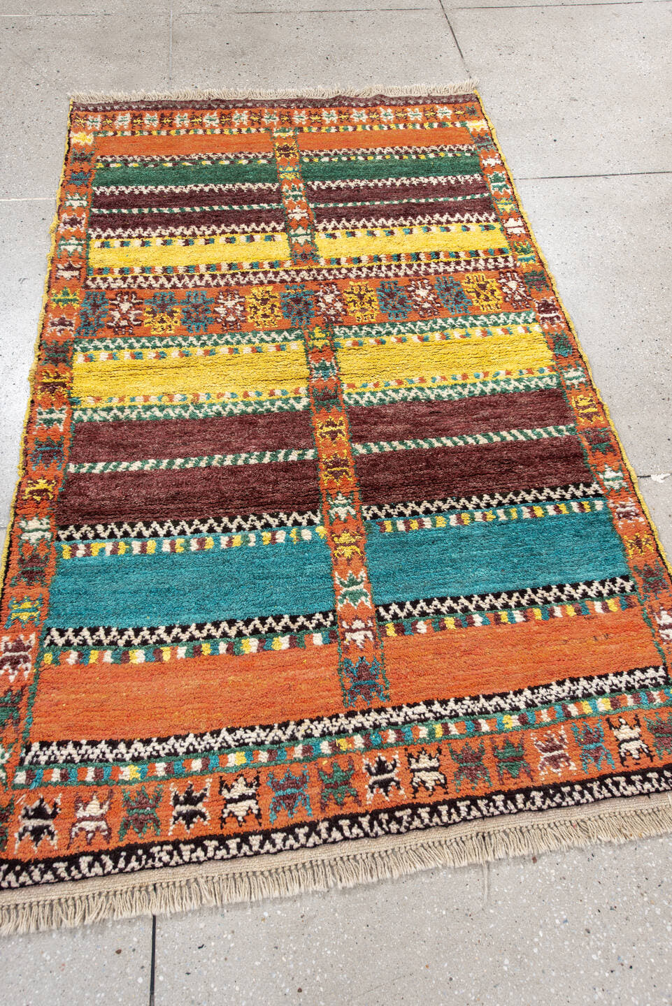 3' x 6' one-of-a-kind handmade vintage Moroccan small size rug. Color palette: orange, brown, turquoise, yellow, green