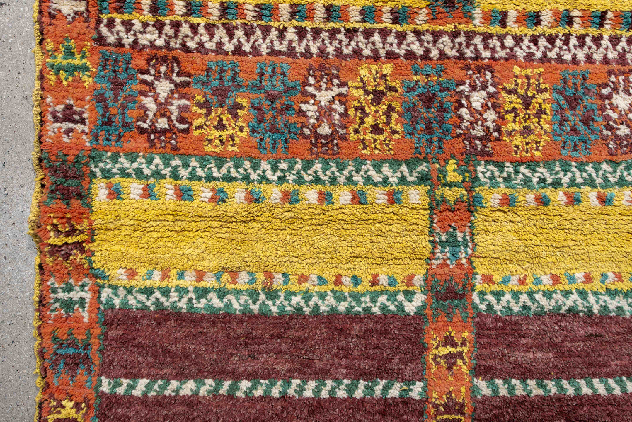 3' x 6' one-of-a-kind handmade vintage Moroccan small size rug. Color palette: orange, brown, turquoise, yellow, green