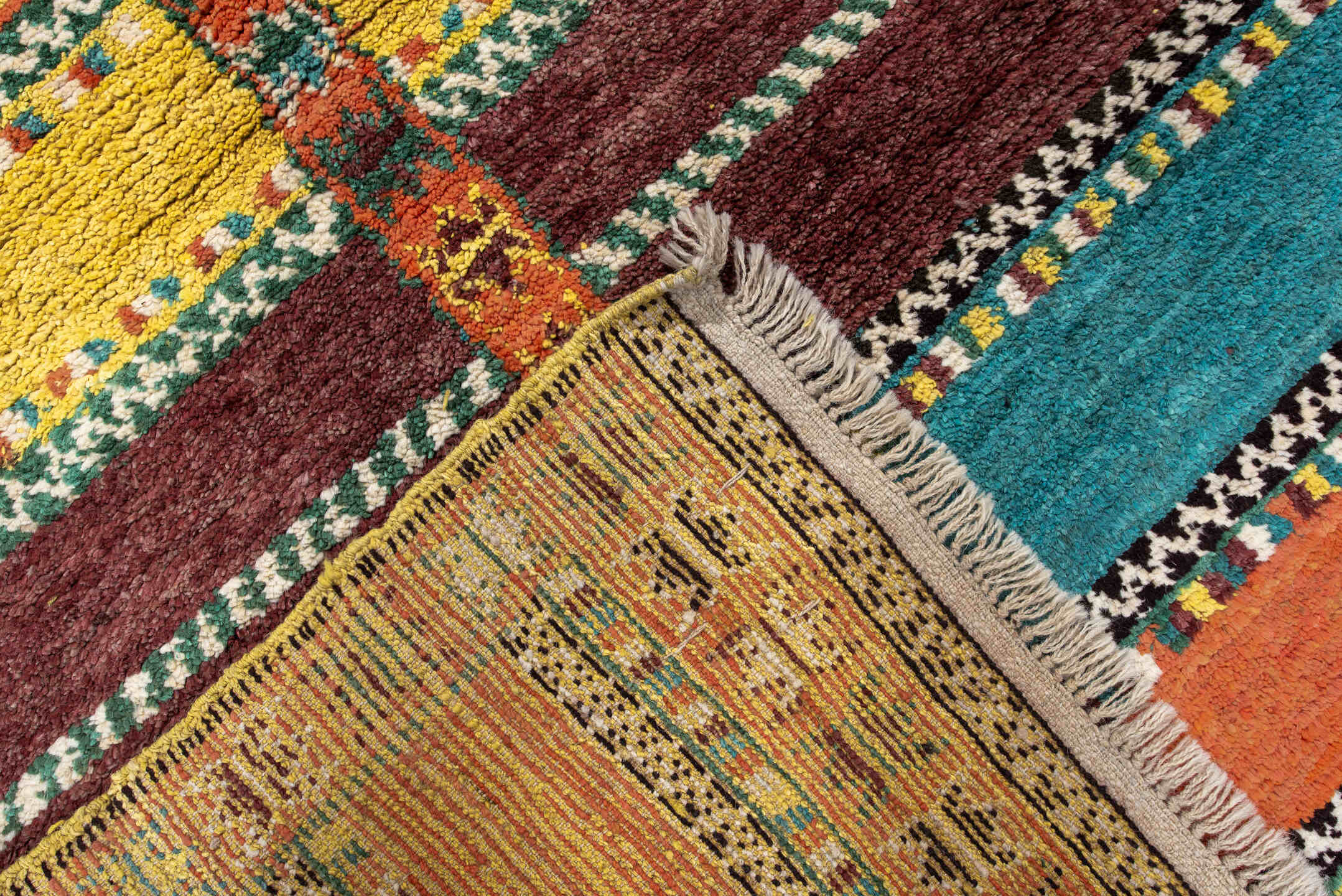 3' x 6' one-of-a-kind handmade vintage Moroccan small size rug. Color palette: orange, brown, turquoise, yellow, green