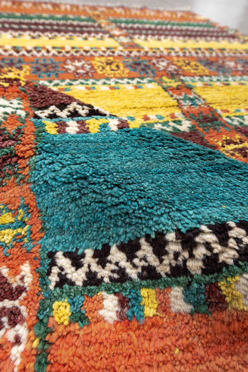 3' x 6' one-of-a-kind handmade vintage Moroccan small size rug. Color palette: orange, brown, turquoise, yellow, green