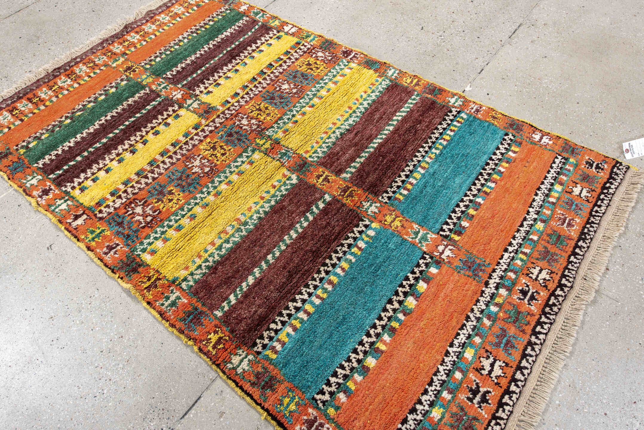 3' x 6' one-of-a-kind handmade vintage Moroccan small size rug. Color palette: orange, brown, turquoise, yellow, green