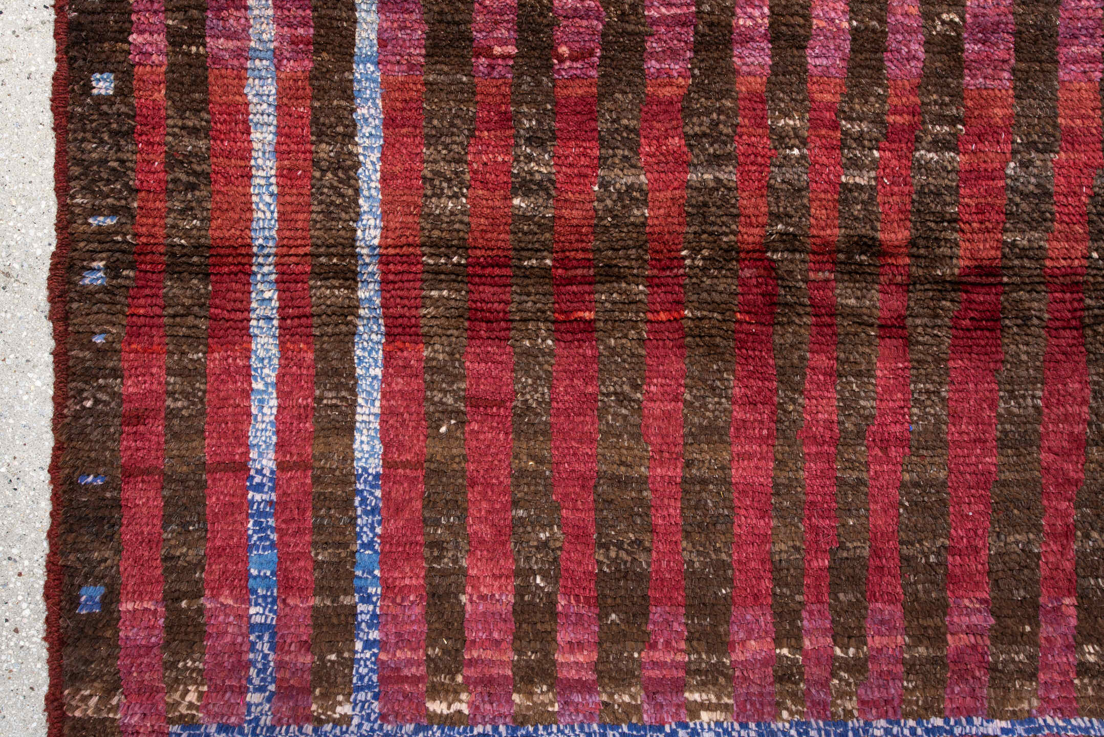 3' x 5' one-of-a-kind handmade vintage Moroccan small size rug. Color palette: brown, crimson, rose, sky blue, burgundy