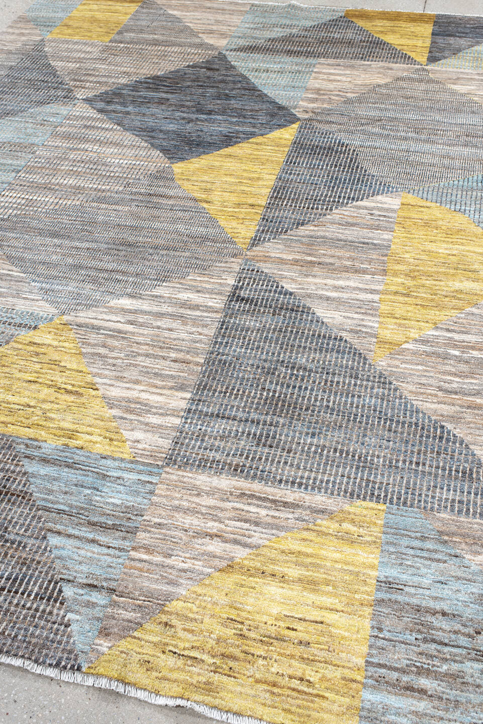 7' x 9' one-of-a-kind handmade handmade Modern rug. Color palette: gray, ivory, gold, light blue, taupe, charcoal, beige