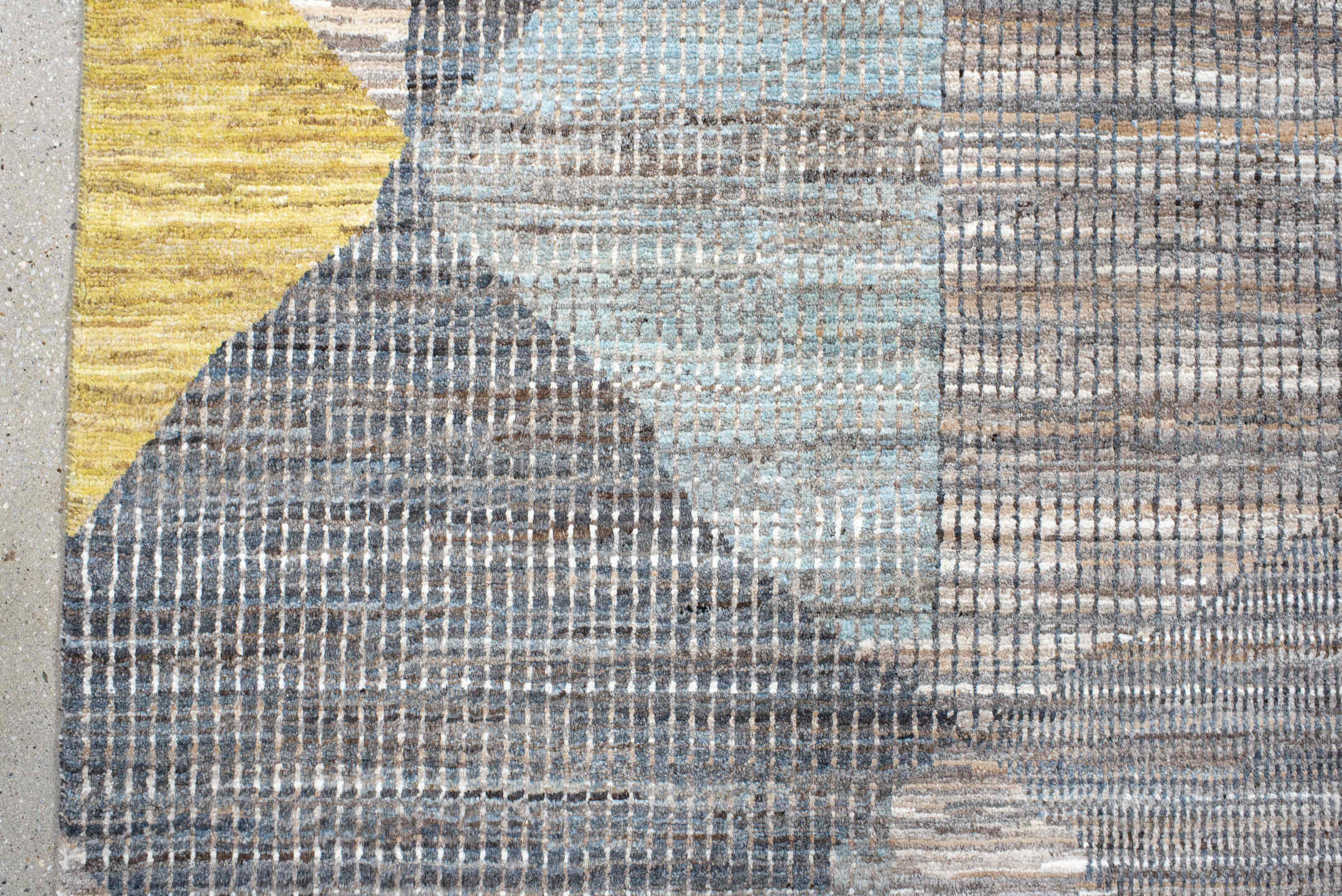 7' x 9' one-of-a-kind handmade handmade Modern rug. Color palette: gray, ivory, gold, light blue, taupe, charcoal, beige