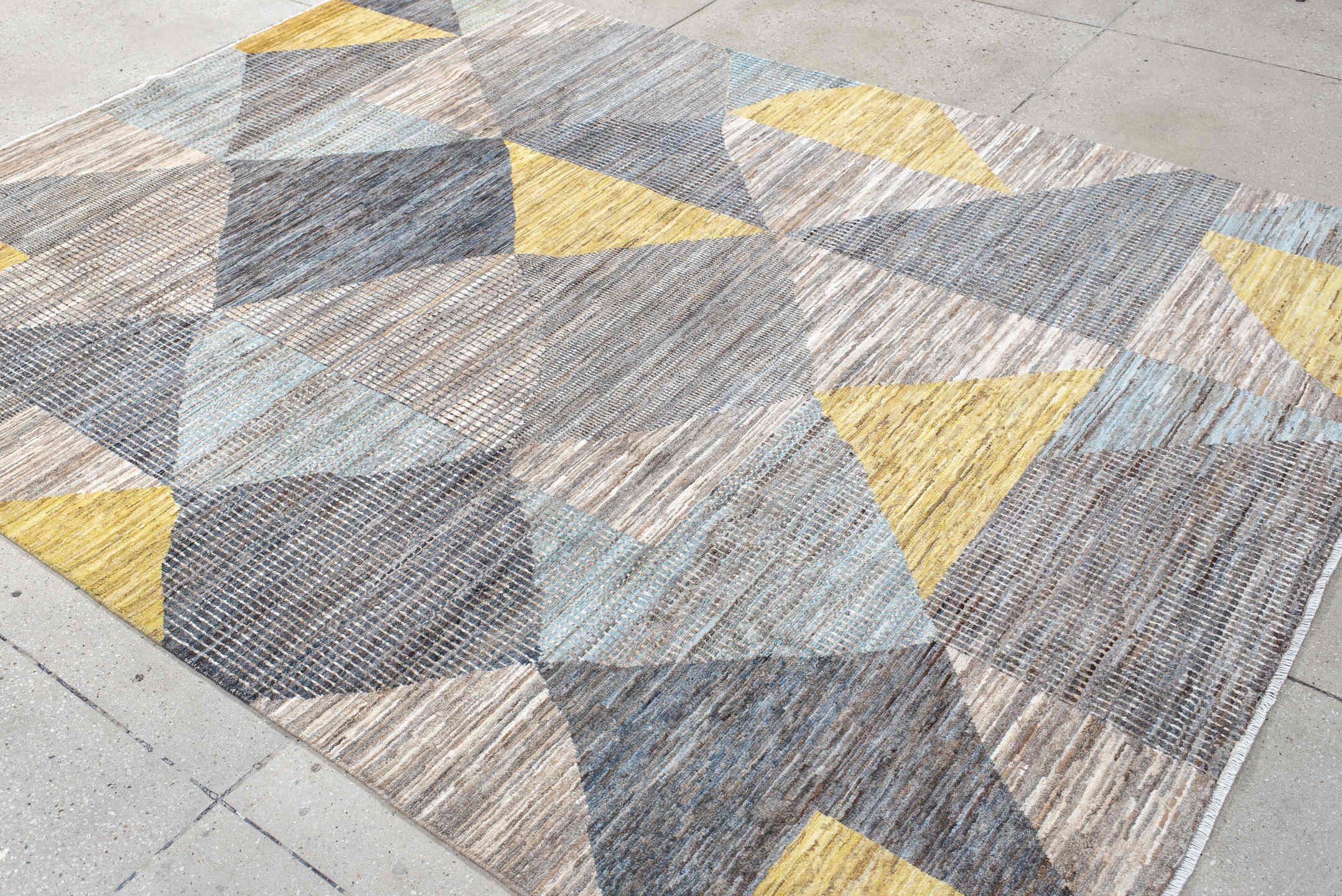 7' x 9' one-of-a-kind handmade handmade Modern rug. Color palette: gray, ivory, gold, light blue, taupe, charcoal, beige