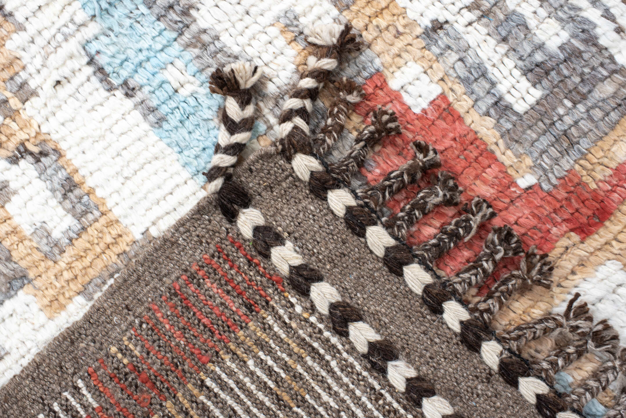7' x 9' one-of-a-kind handmade vintage Tulu rug. Color palette: ivory, terra cotta, gray, pale aqua, camel, brown