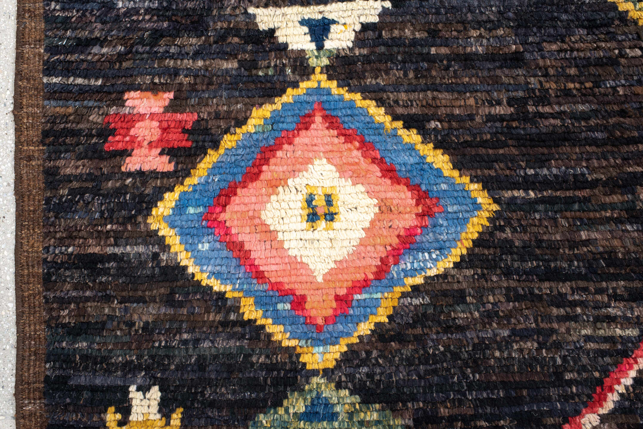8' x 9' one-of-a-kind handmade vintage Tulu rug. Color palette: charcoal, brown, sky blue, ivory, rust, gold, coral, sage
