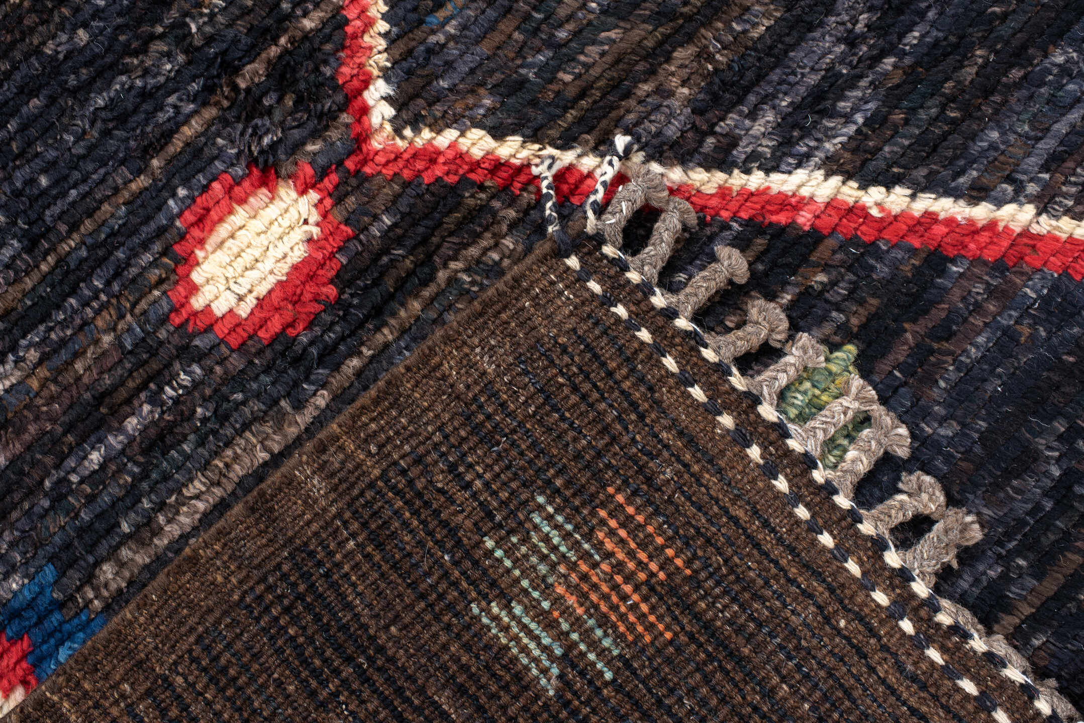 8' x 9' one-of-a-kind handmade vintage Tulu rug. Color palette: charcoal, brown, sky blue, ivory, rust, gold, coral, sage