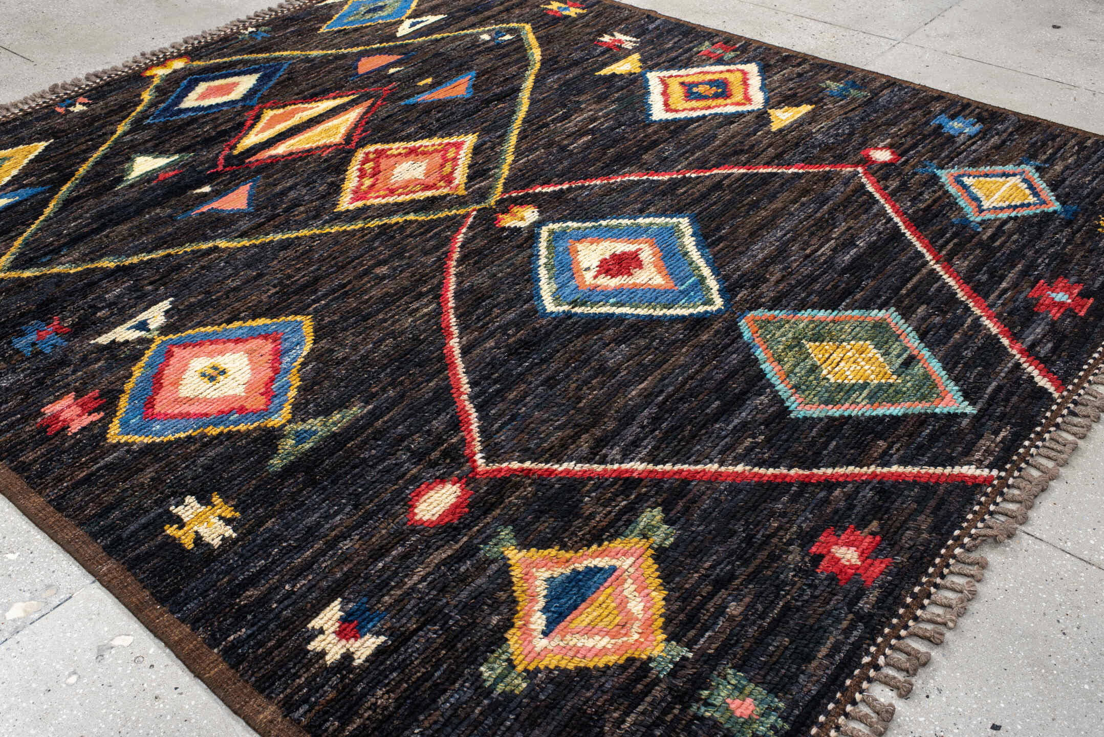 8' x 9' one-of-a-kind handmade vintage Tulu rug. Color palette: charcoal, brown, sky blue, ivory, rust, gold, coral, sage