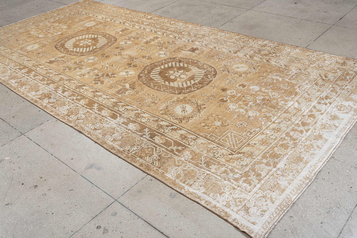 6' x 10' one-of-a-kind handmade antique Khotan large size rug. Color palette: camel, ivory, sand, taupe, beige, warm gray