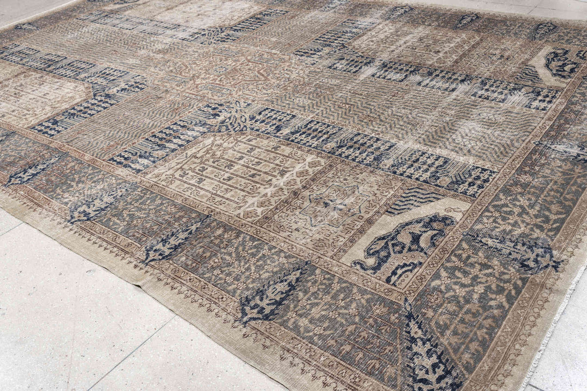 9' x 15' one-of-a-kind handmade vintage Sparta rug. Color palette: ivory, taupe, slate blue, charcoal, beige, navy, camel
