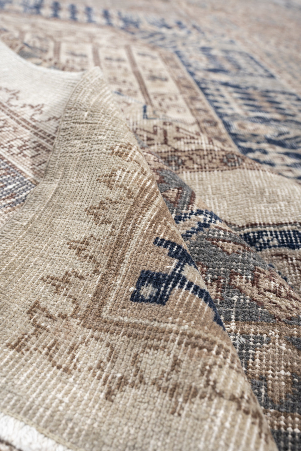9' x 15' one-of-a-kind handmade vintage Sparta rug. Color palette: ivory, taupe, slate blue, charcoal, beige, navy, camel