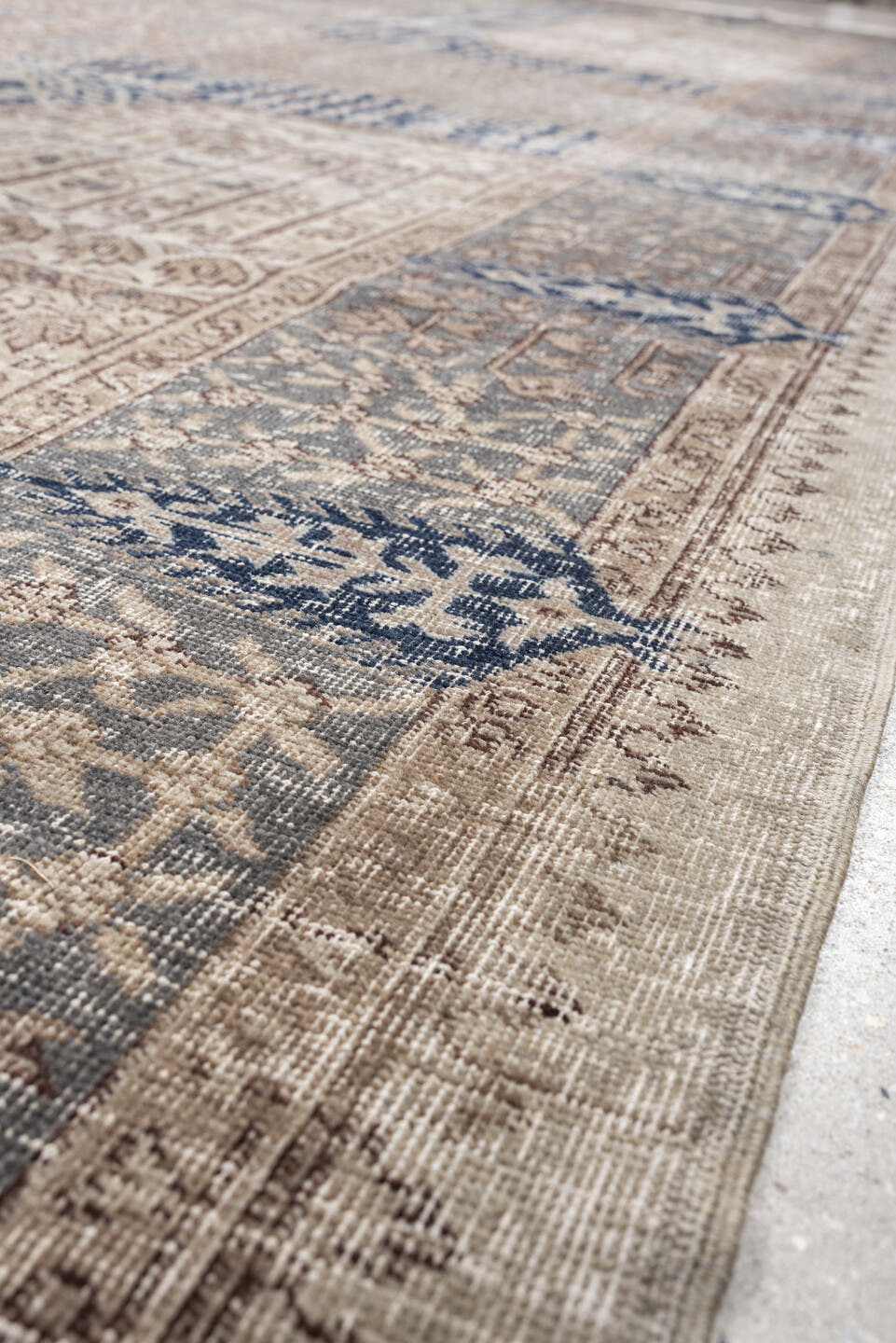 9' x 15' one-of-a-kind handmade vintage Sparta rug. Color palette: ivory, taupe, slate blue, charcoal, beige, navy, camel