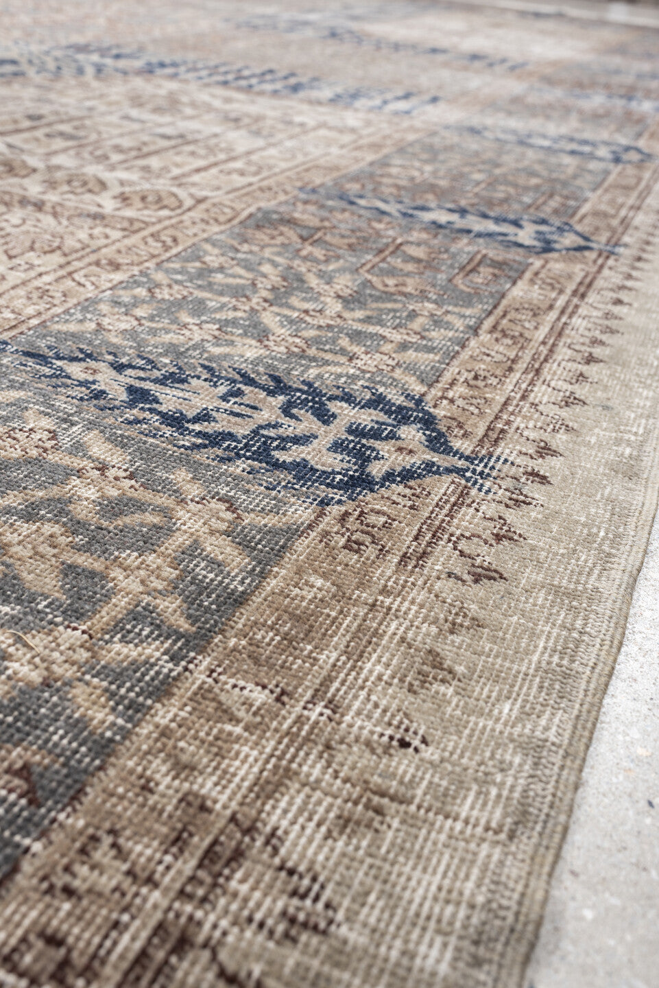 9' x 15' one-of-a-kind handmade vintage Sparta rug. Color palette: ivory, taupe, slate blue, charcoal, beige, navy, camel