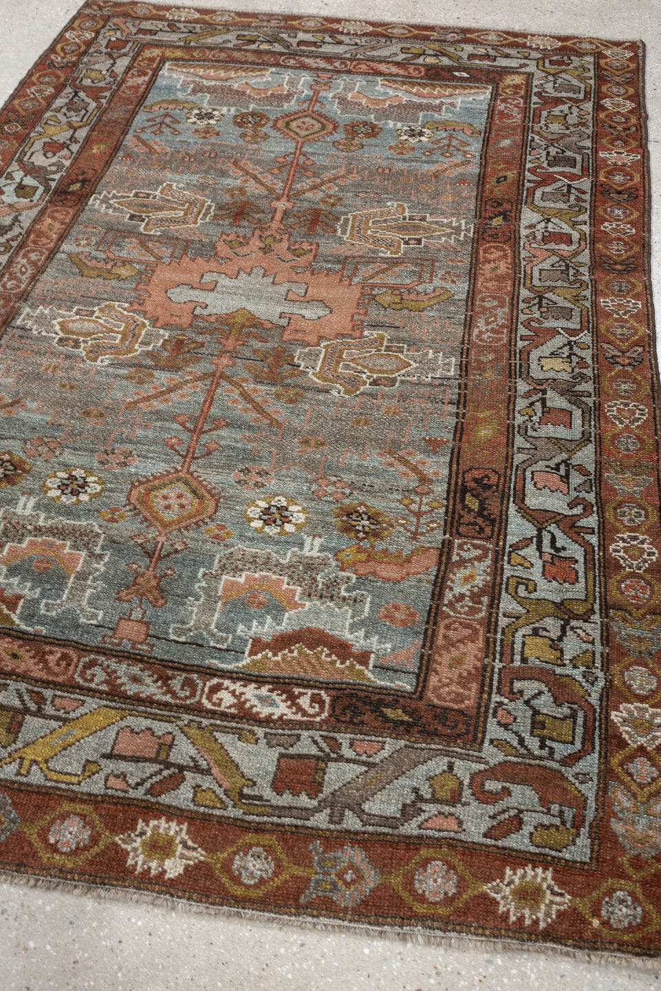 4' x 6' one-of-a-kind handmade antique Baktiary rug. Color palette: blue gray, rust, ivory, rose, taupe, camel, olive, brown