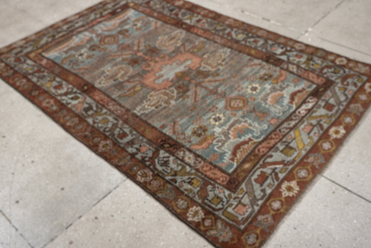 4' x 6' one-of-a-kind handmade antique Baktiary rug. Color palette: blue gray, rust, ivory, rose, taupe, camel, olive, brown