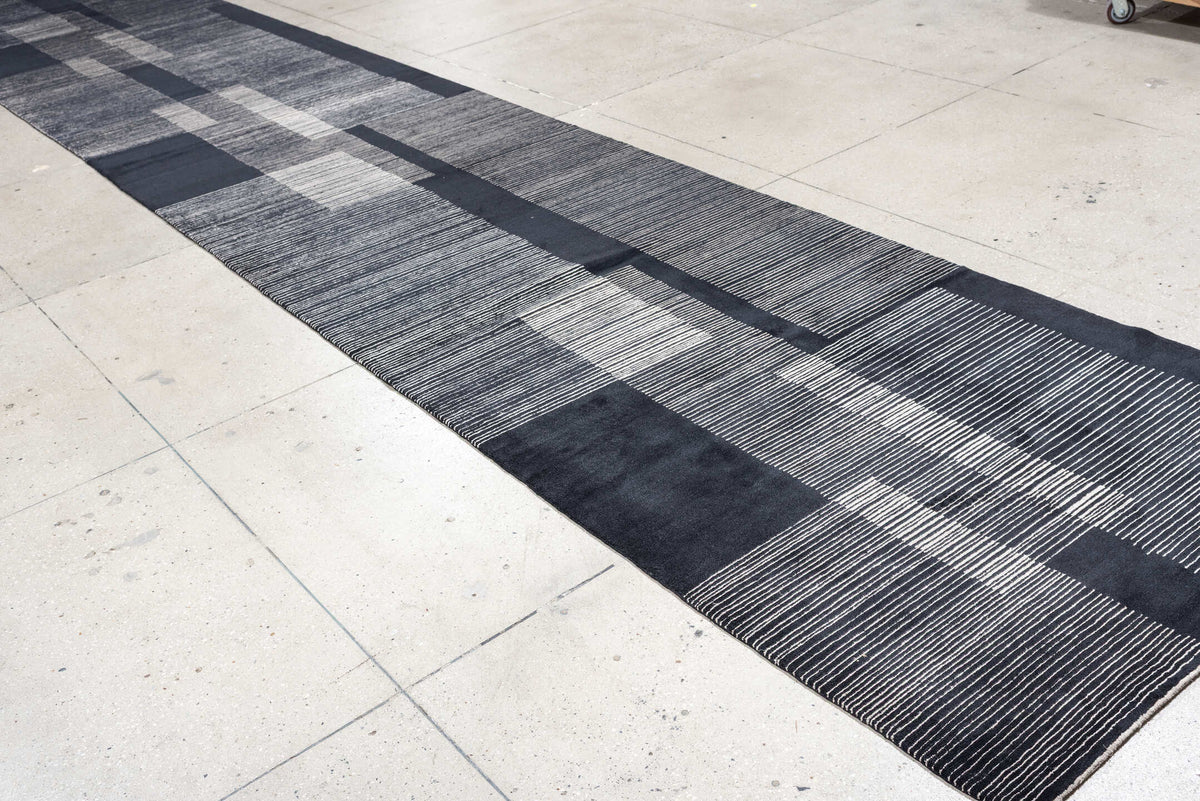4' x 22' one-of-a-kind handmade antique Tibetan runner rug. Color palette: charcoal, slate, ivory, pewter, ebony, black