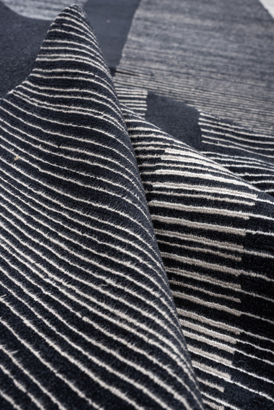 4' x 22' one-of-a-kind handmade antique Tibetan runner rug. Color palette: charcoal, slate, ivory, pewter, ebony, black