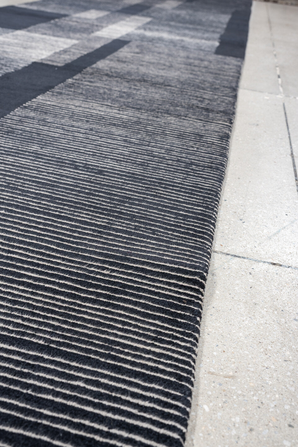 4' x 22' one-of-a-kind handmade antique Tibetan runner rug. Color palette: charcoal, slate, ivory, pewter, ebony, black