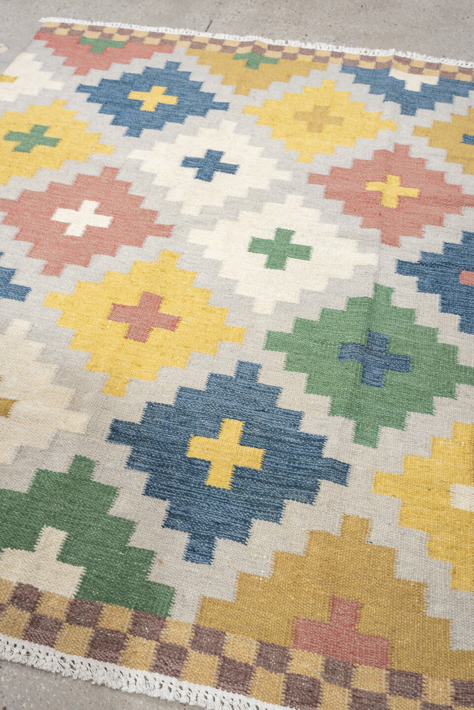 4' x 6' one-of-a-kind handmade antique Rollaken rug. Color palette: ivory, denim blue, yellow, sage green, dusty rose