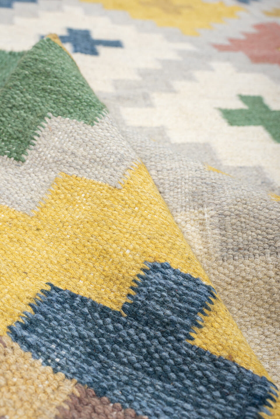 4' x 6' one-of-a-kind handmade antique Rollaken rug. Color palette: ivory, denim blue, yellow, sage green, dusty rose