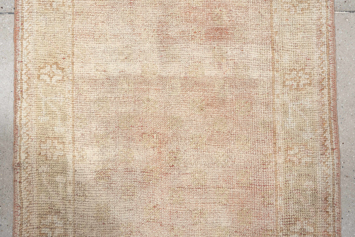 3' x 11' one-of-a-kind handmade antique Oushak runner rug. Color palette: ivory, blush, beige, soft sage, peach, pink