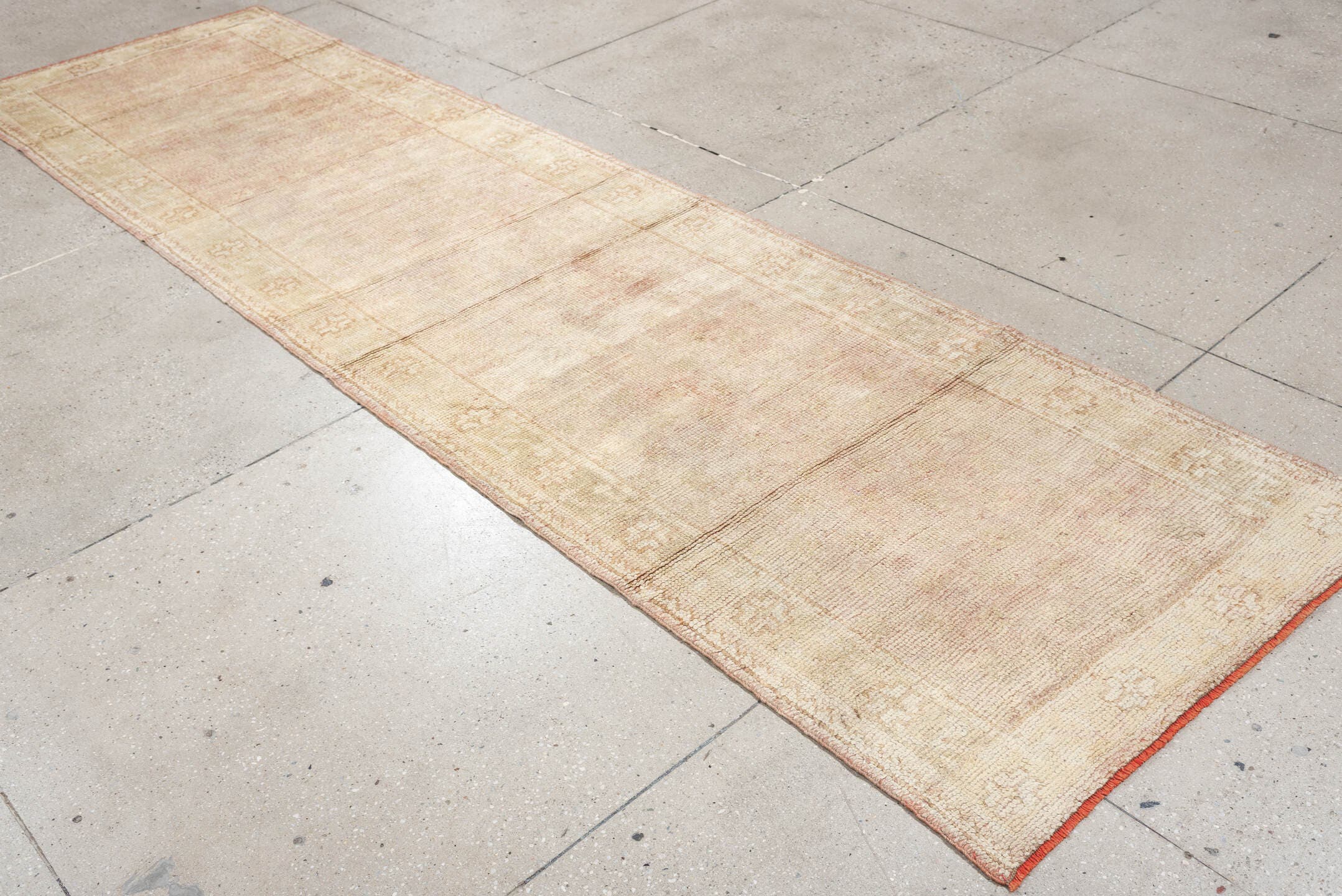3' x 11' one-of-a-kind handmade antique Oushak runner rug. Color palette: ivory, blush, beige, soft sage, peach, pink