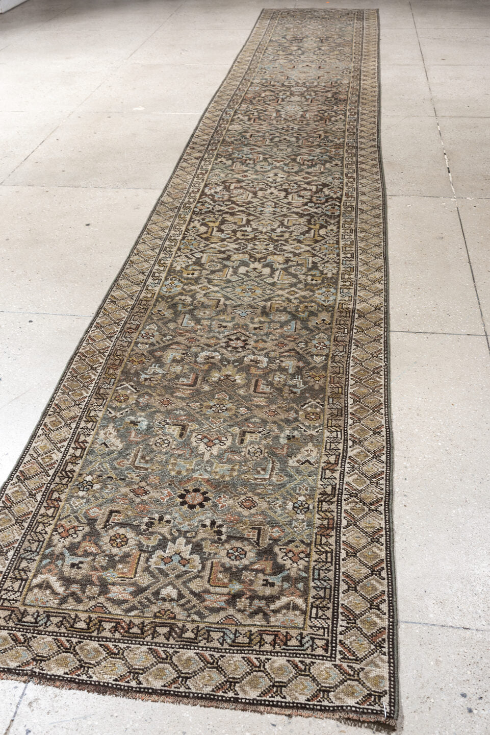 2' x 18' one-of-a-kind handmade antique runner rug. Color palette: blue gray, ivory, camel, charcoal, rust, taupe, sage