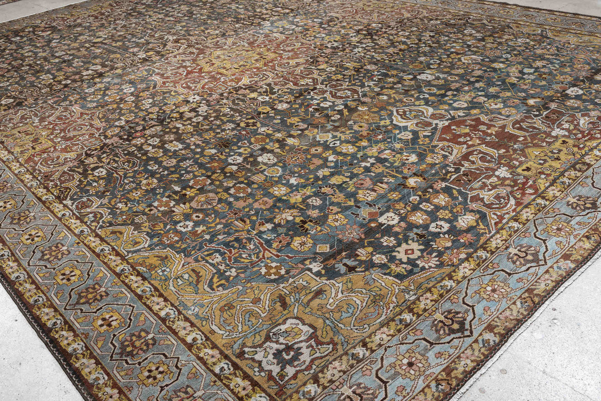13' x 19' one-of-a-kind handmade antique Baktiary oversize rug. Color palette: charcoal, teal, rust, pale blue, ivory, gold
