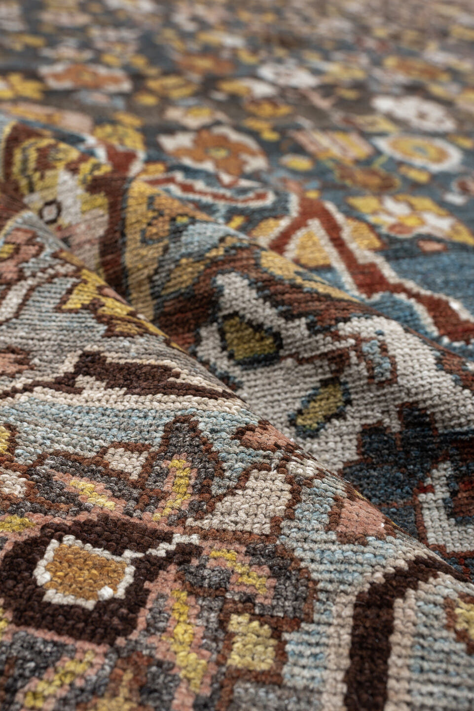 13' x 19' one-of-a-kind handmade antique Baktiary oversize rug. Color palette: charcoal, teal, rust, pale blue, ivory, gold