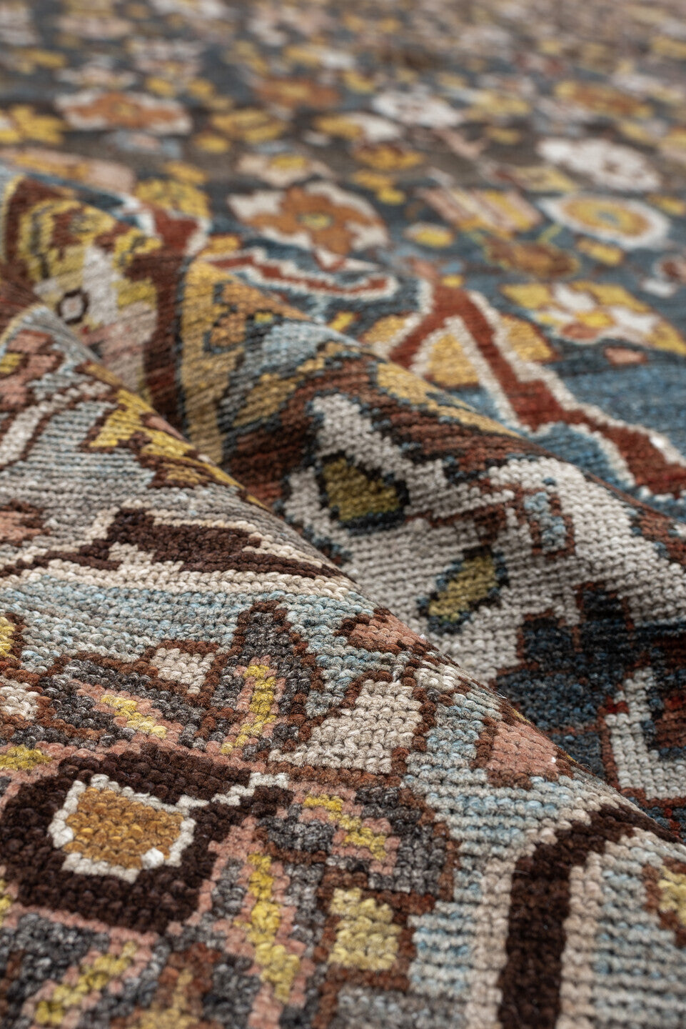 13' x 19' one-of-a-kind handmade antique Baktiary oversize rug. Color palette: charcoal, teal, rust, pale blue, ivory, gold