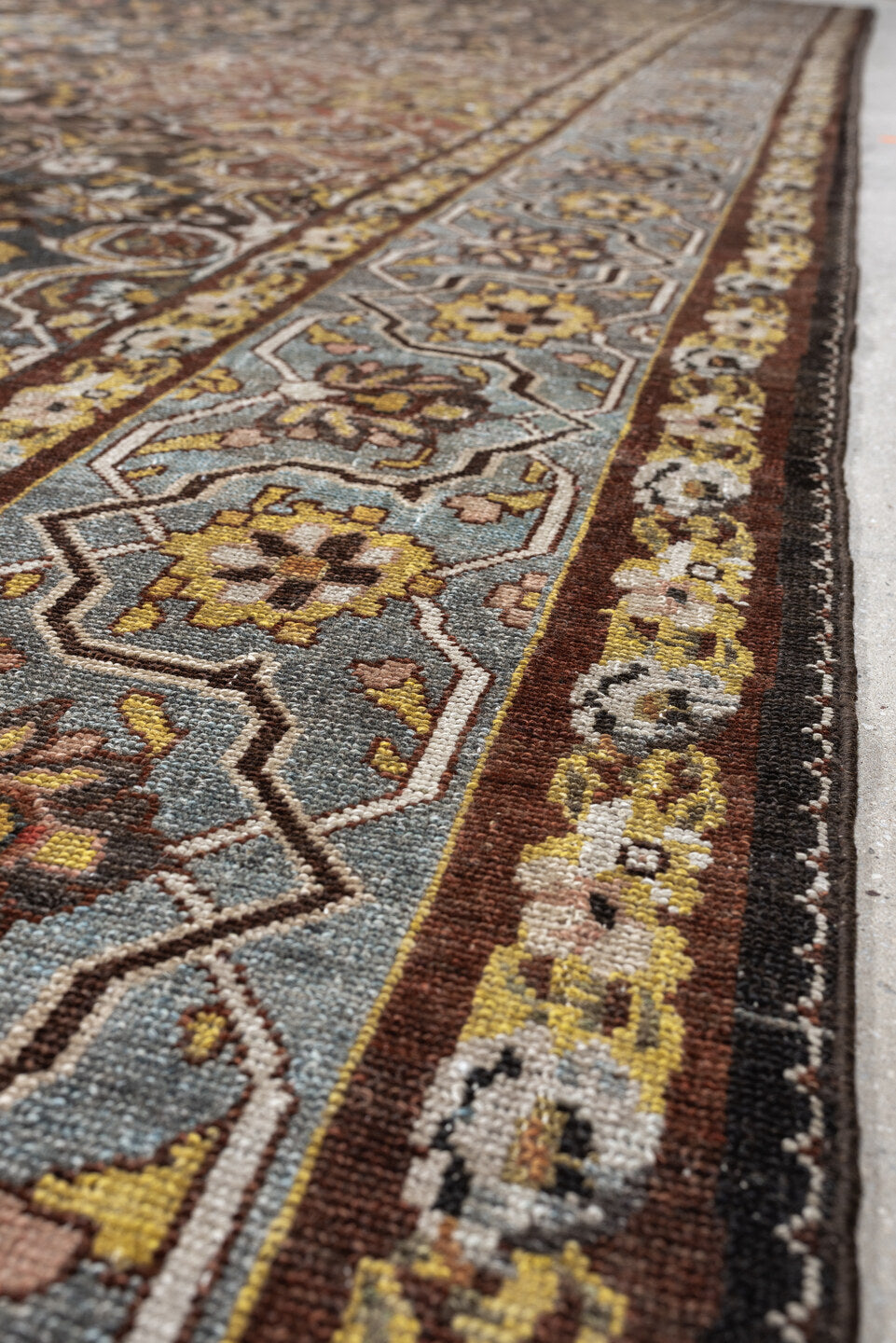 13' x 19' one-of-a-kind handmade antique Baktiary oversize rug. Color palette: charcoal, teal, rust, pale blue, ivory, gold