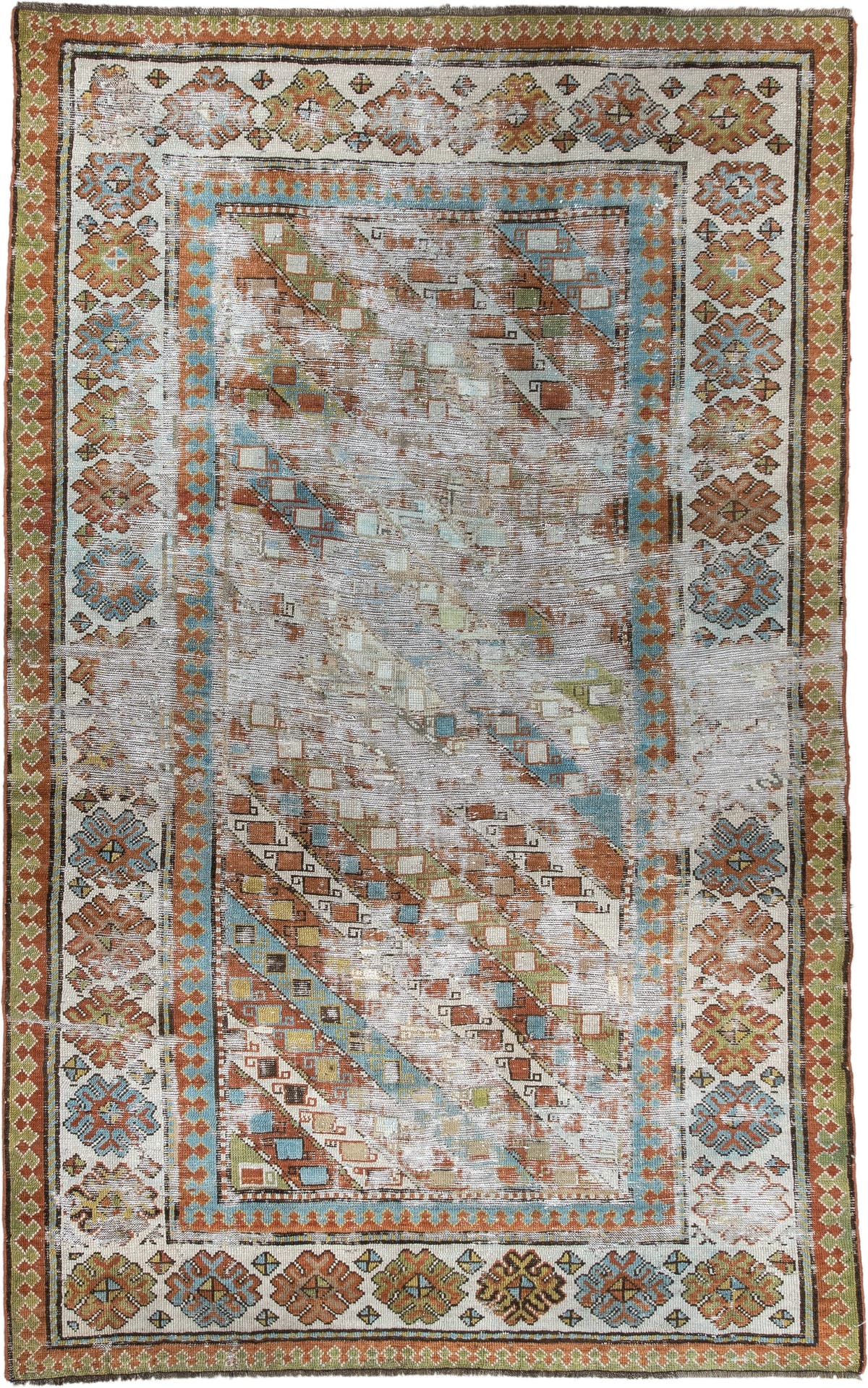 4' x 6' one-of-a-kind handmade antique Caucasian rug. Color palette: ivory, rust, sky blue, olive, camel, taupe, brown