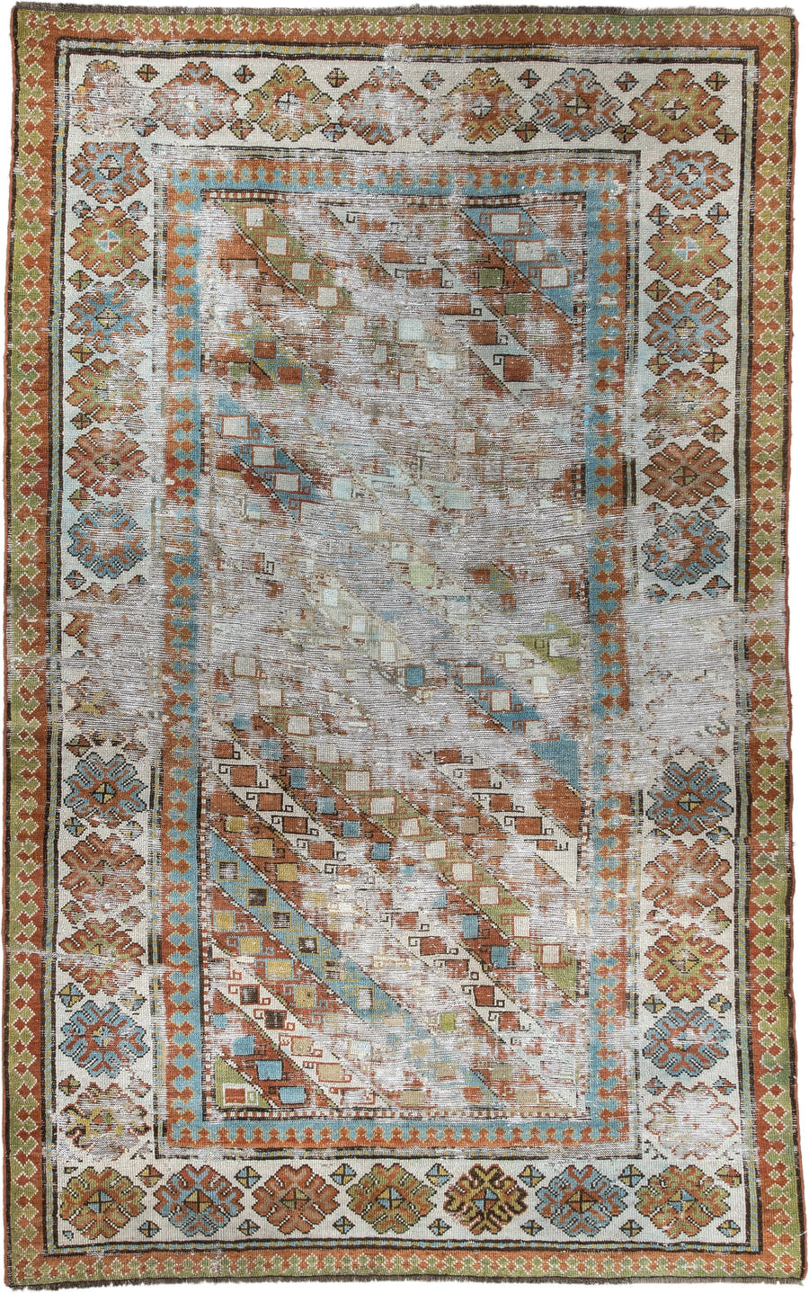 4' x 6' one-of-a-kind handmade antique Caucasian rug. Color palette: ivory, rust, sky blue, olive, camel, taupe, brown
