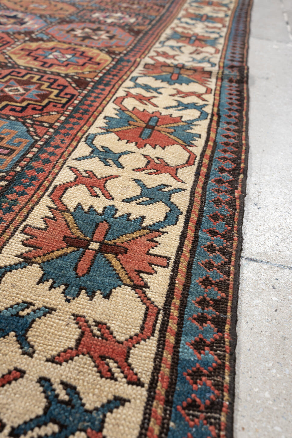 3' x 13' one-of-a-kind handmade antique Caucasian runner rug. Color palette: indigo, ivory, rust, coral, teal, charcoal