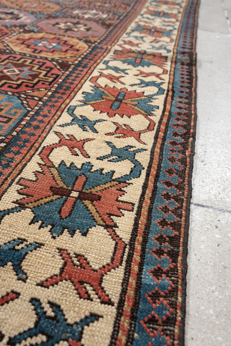 3' x 13' one-of-a-kind handmade antique Caucasian runner rug. Color palette: indigo, ivory, rust, coral, teal, charcoal