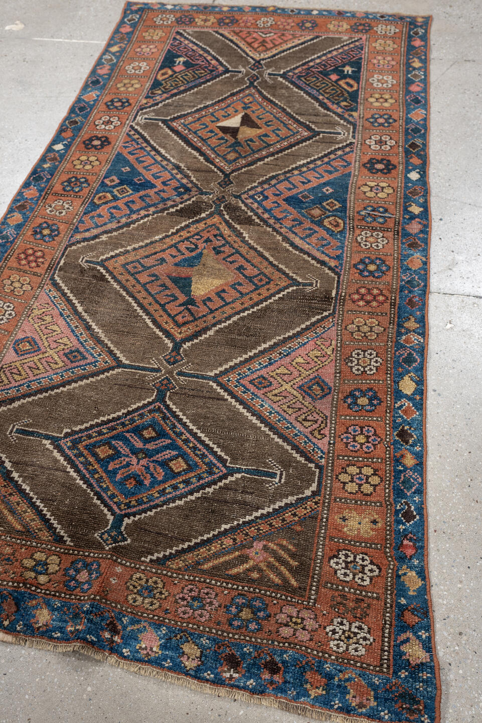 3' x 6' one-of-a-kind handmade antique Kurd runner rug. Color palette: teal blue, camel, rose, ivory, brown, navy, salmon