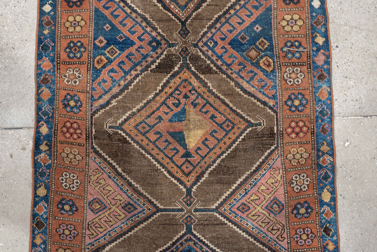 3' x 6' one-of-a-kind handmade antique Kurd runner rug. Color palette: teal blue, camel, rose, ivory, brown, navy, salmon