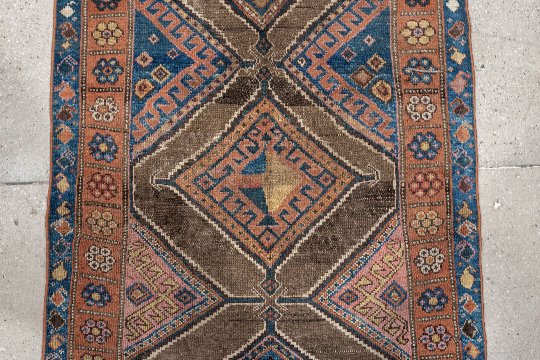 3' x 6' one-of-a-kind handmade antique Kurd runner rug. Color palette: teal blue, camel, rose, ivory, brown, navy, salmon