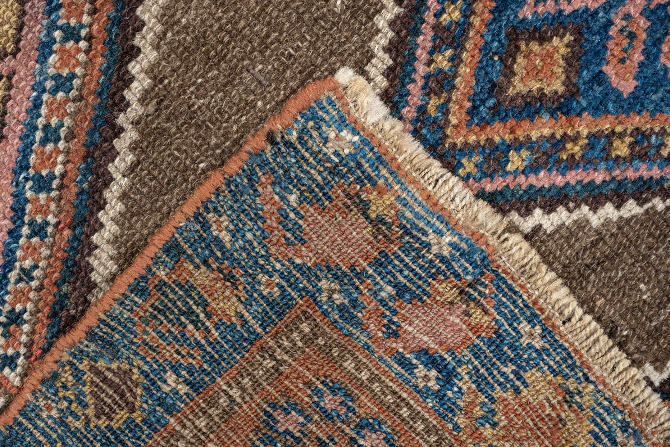 3' x 6' one-of-a-kind handmade antique Kurd runner rug. Color palette: teal blue, camel, rose, ivory, brown, navy, salmon
