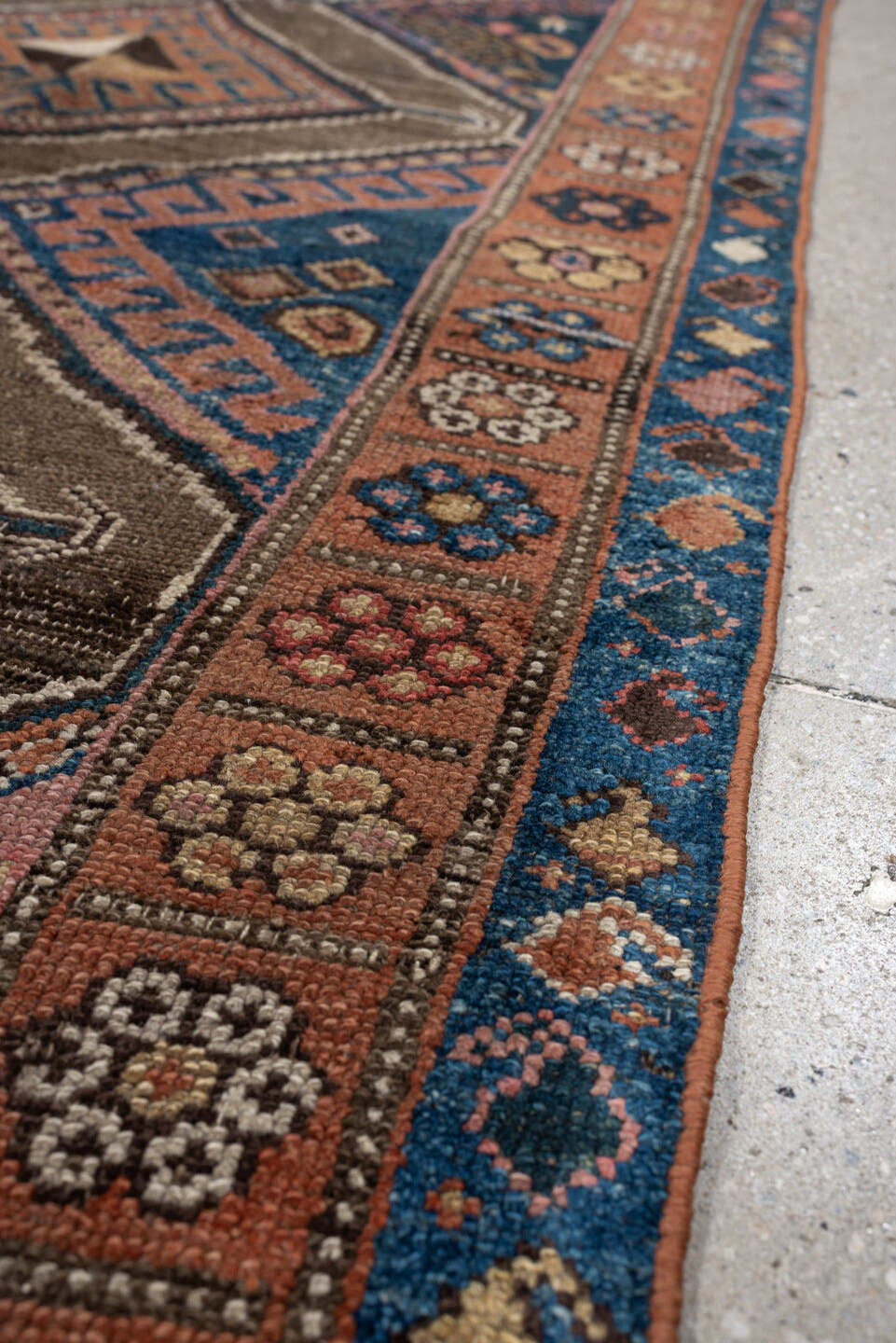 3' x 6' one-of-a-kind handmade antique Kurd runner rug. Color palette: teal blue, camel, rose, ivory, brown, navy, salmon