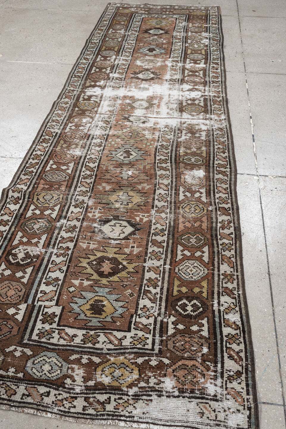 3' x 10' one-of-a-kind handmade antique NW Persian runner rug. Color palette: terra cotta, ivory, brown, olive, camel, taupe