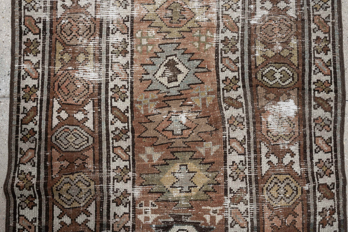 3' x 10' one-of-a-kind handmade antique NW Persian runner rug. Color palette: terra cotta, ivory, brown, olive, camel, taupe