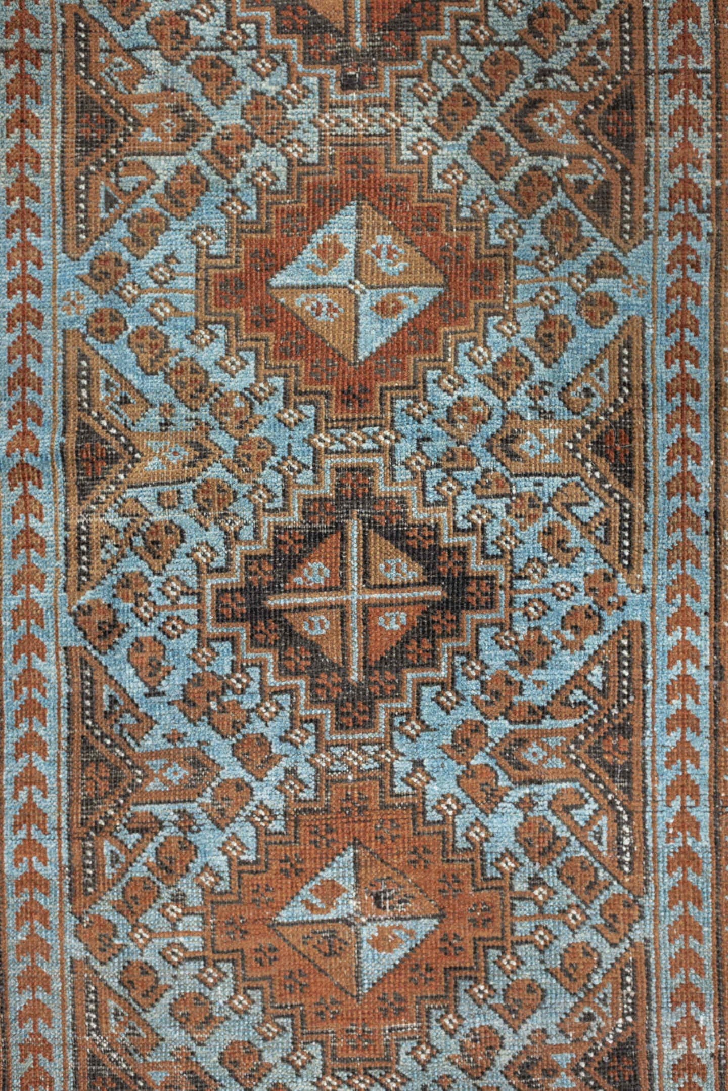 2' x 4' one-of-a-kind handmade antique Belouch small size rug. Color palette: rust, pale blue, camel, dark brown, ivory