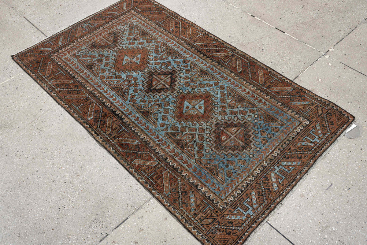 2' x 4' one-of-a-kind handmade antique Belouch small size rug. Color palette: rust, pale blue, camel, dark brown, ivory